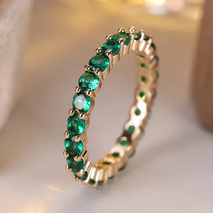 Anillo de eternidad esmeralda de oro