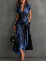 Vestido midi cruzado con estampado abstracto rojo y negro, escote en V, mangas cortas, cinturón y bajo asimétrico con volantes