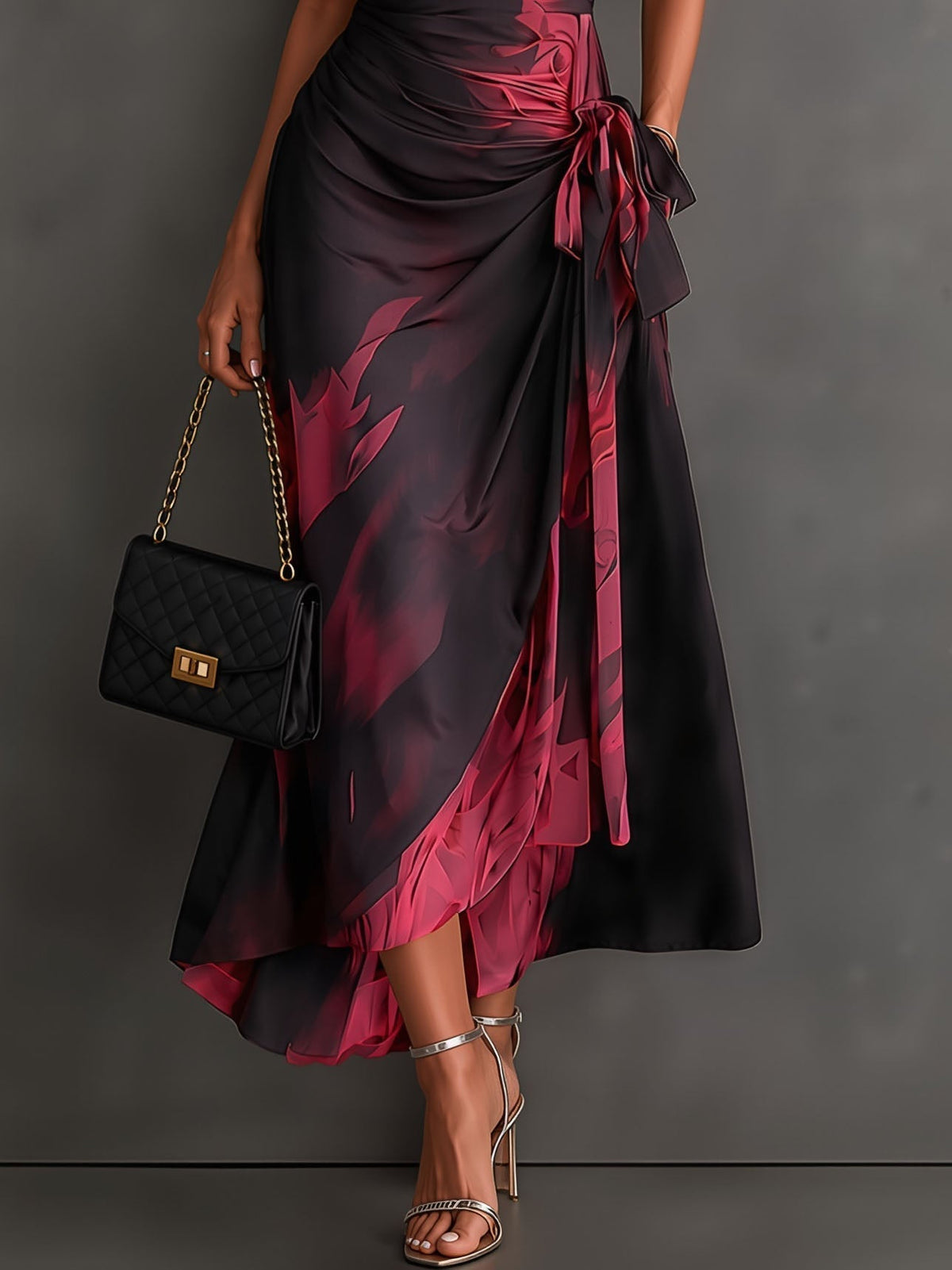 Vestido midi cruzado con estampado abstracto rojo y negro, escote en V, mangas cortas, cinturón y bajo asimétrico con volantes